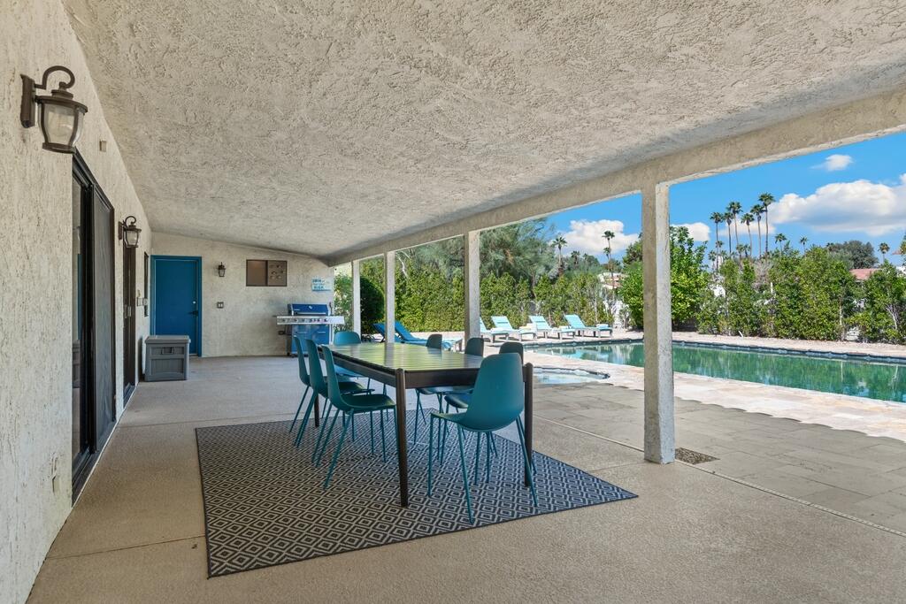 3060 East Verona Road Palm Springs, CA 92262 - Photo 24 of 33 a dining room with furniture and a floor to ceiling window