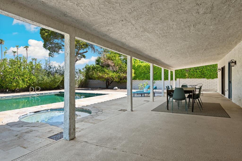 3060 East Verona Road Palm Springs, CA 92262 - Photo 28 of 33 a view of a patio with a table chairs and a yard