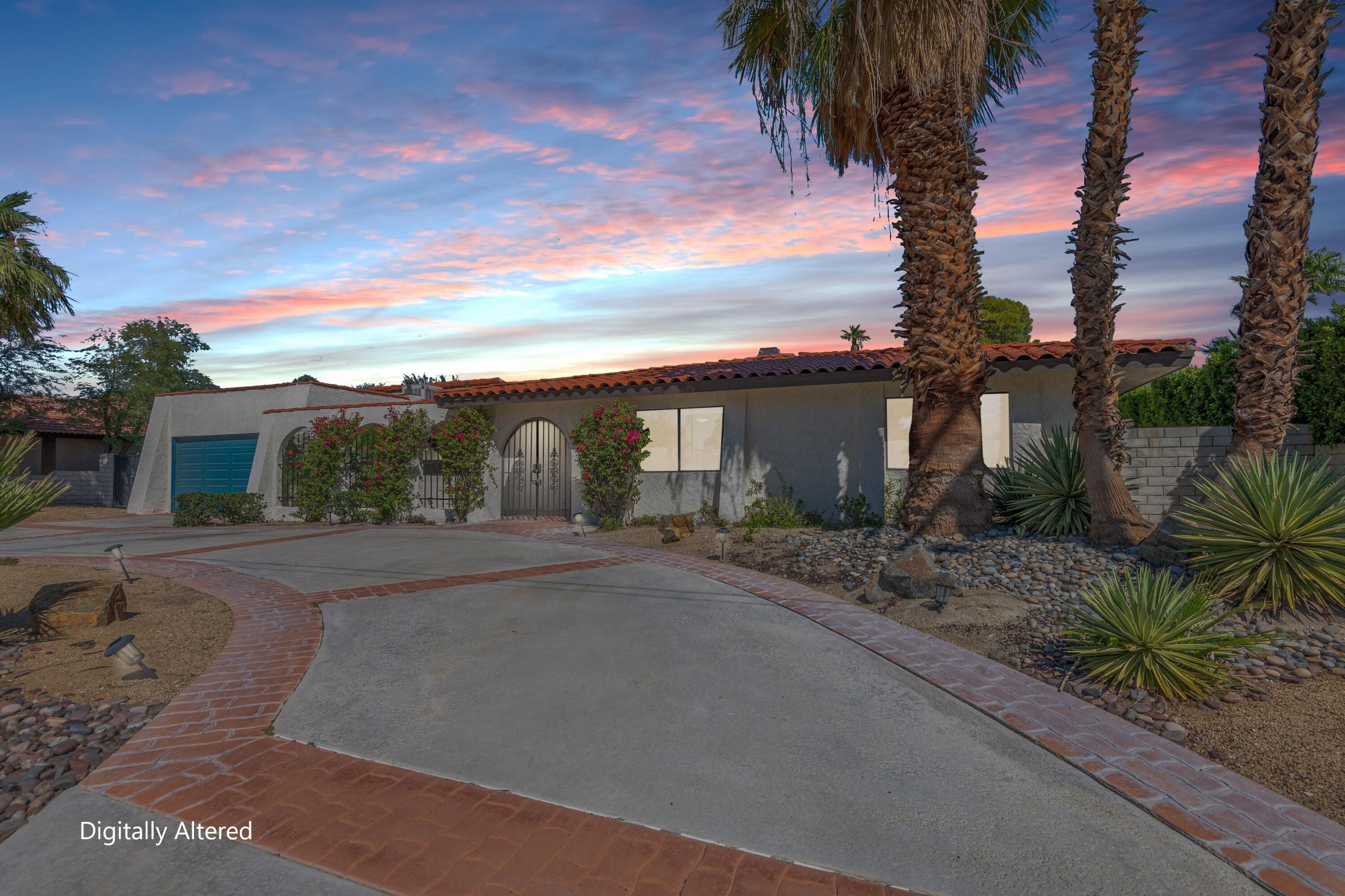 3060 East Verona Road Palm Springs, CA 92262 - Photo 31 of 33 a front view of a house with a yard and potted plants