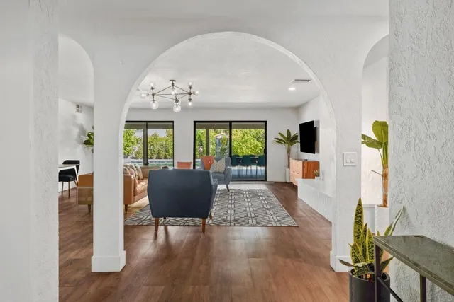 a living room with fireplace furniture and a flat screen tv