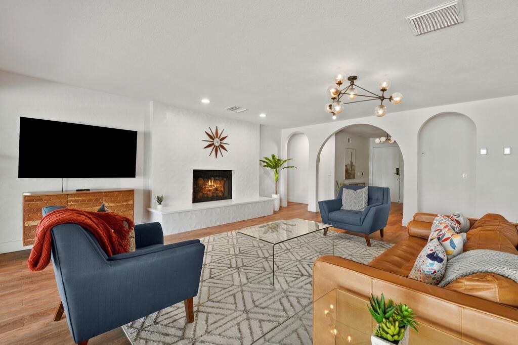 3060 East Verona Road Palm Springs, CA 92262 - Photo 4 of 33 a living room with fireplace furniture and a flat screen tv