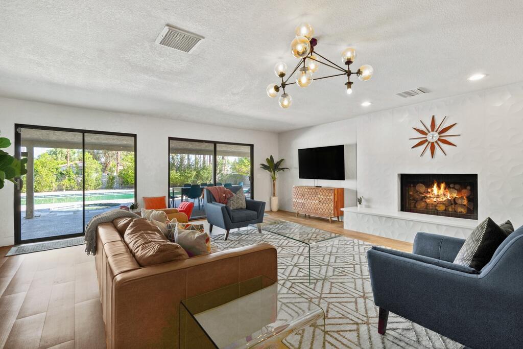 3060 East Verona Road Palm Springs, CA 92262 - Photo 6 of 33 a living room with furniture a flat screen tv and a large window