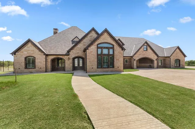 front view of a house with a yard