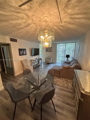 a view of a livingroom with furniture and window