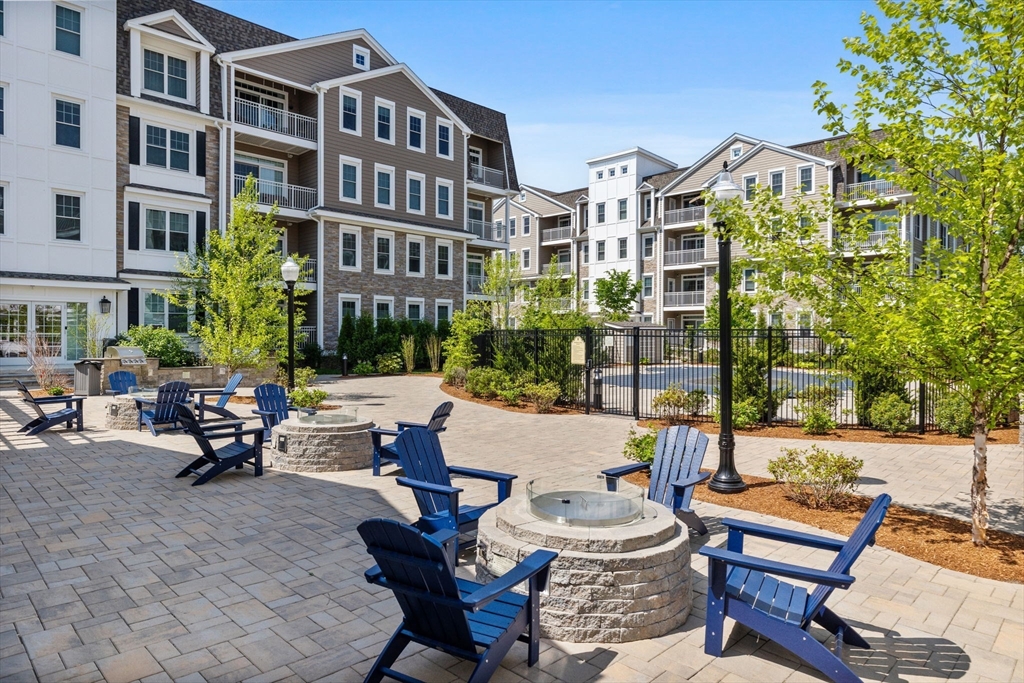 320 Middlesex Avenue, Unit B109 Medford, MA 02155 - Photo 12 of 21 a building outdoor space with patio furniture and potted plants