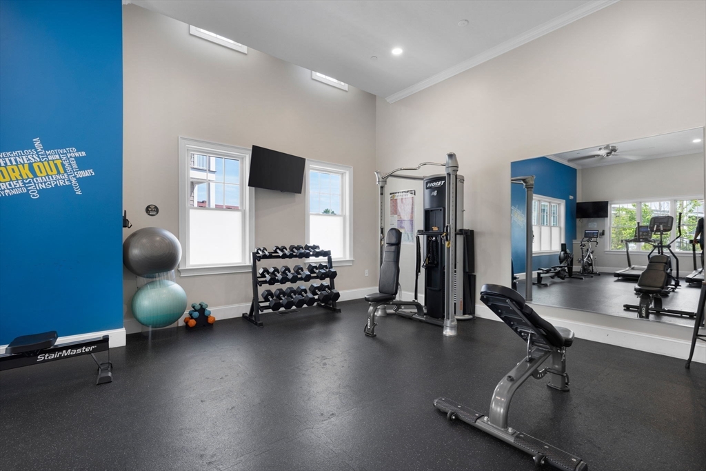 320 Middlesex Avenue, Unit B109 Medford, MA 02155 - Photo 15 of 21 a gym room with gym equipment and a large window