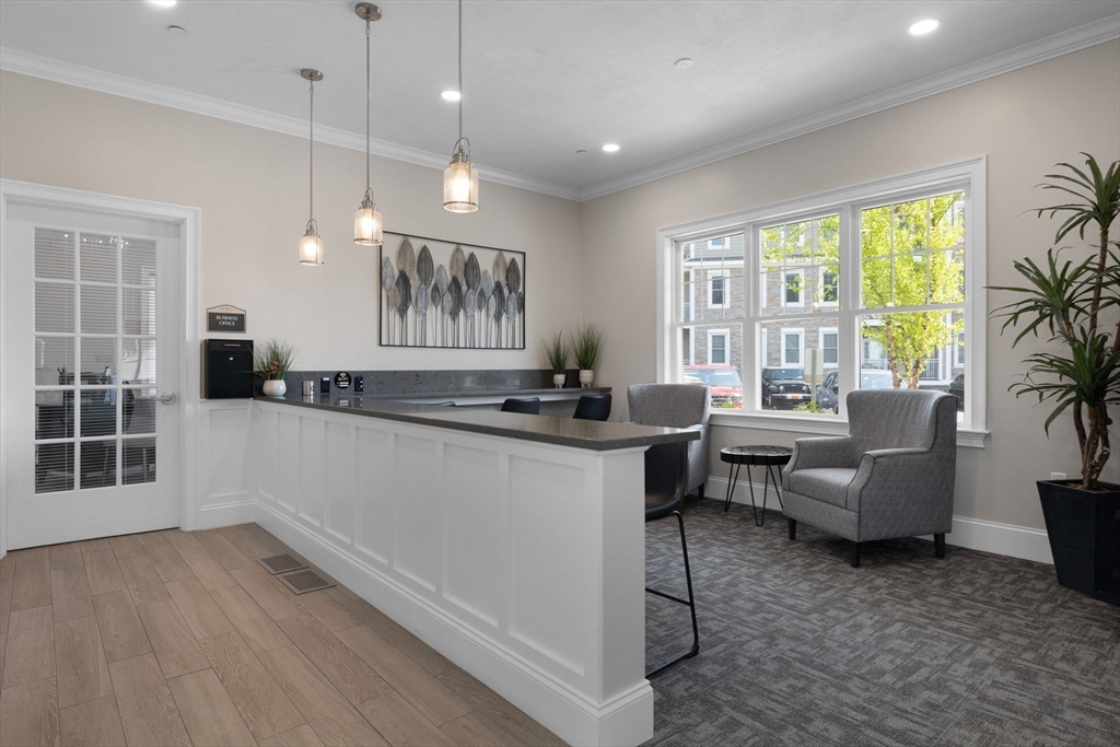 320 Middlesex Avenue, Unit B109 Medford, MA 02155 - Photo 20 of 21 a living room with furniture and windows
