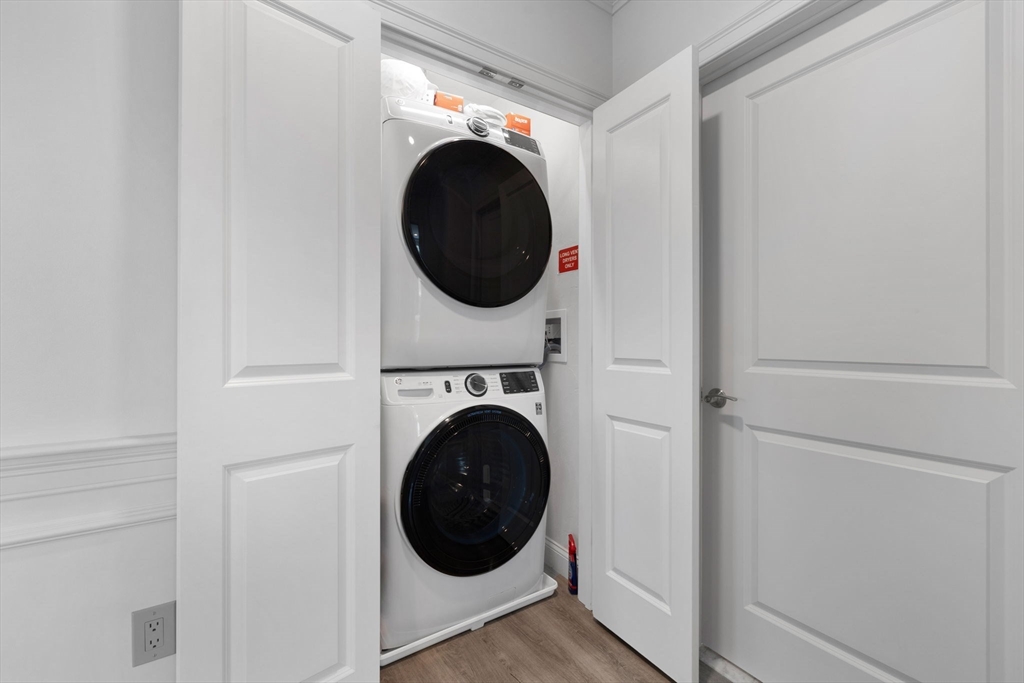 320 Middlesex Avenue, Unit B109 Medford, MA 02155 - Photo 9 of 21 a view of a hallway with washer and dryer