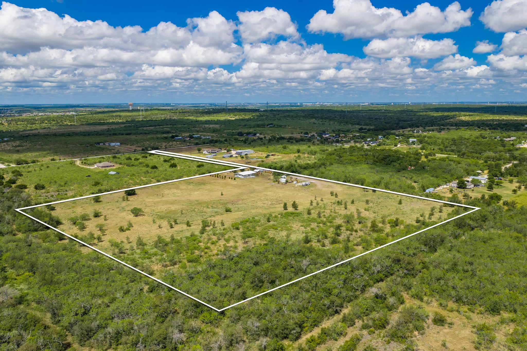 8804 Williamson Road Buda, TX 78610 - Photo 2 of 37 Expansive pastures and mature trees outline the borders of this private countryside acreage.