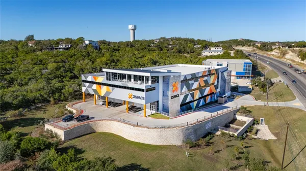an aerial view of a house with a garden