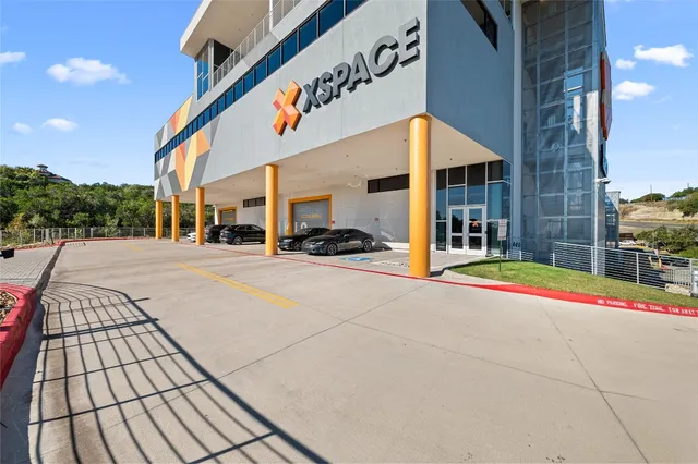 a outdoor view of a building with traffic signal lights