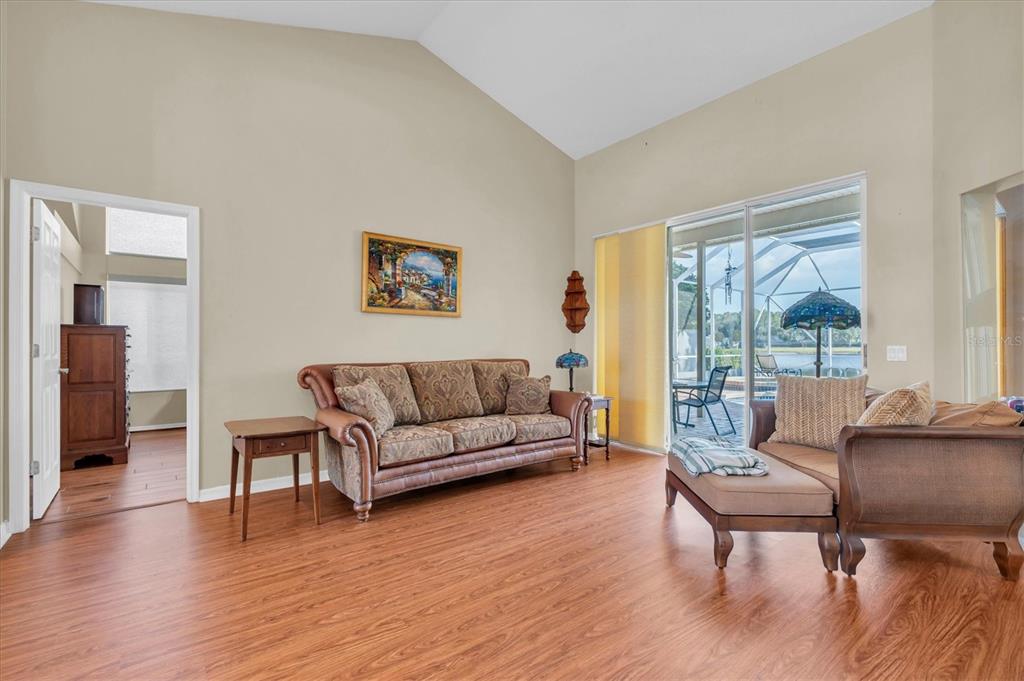 1226 Hoversham Drive New Port Richey, FL 34655 - Photo 11 of 41 a living room with furniture and a wooden floor
