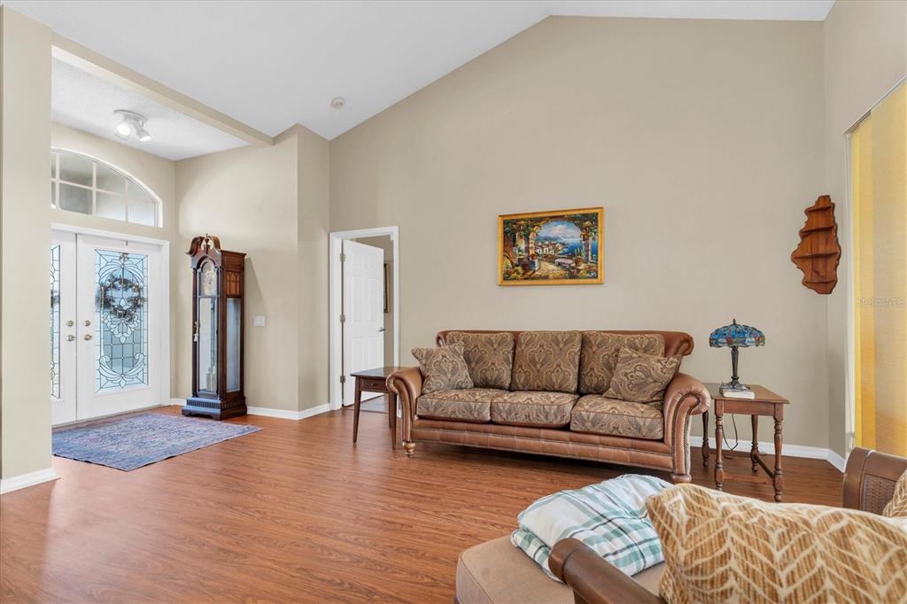 1226 Hoversham Drive New Port Richey, FL 34655 - Photo 13 of 41 a living room with furniture window and a wooden floor