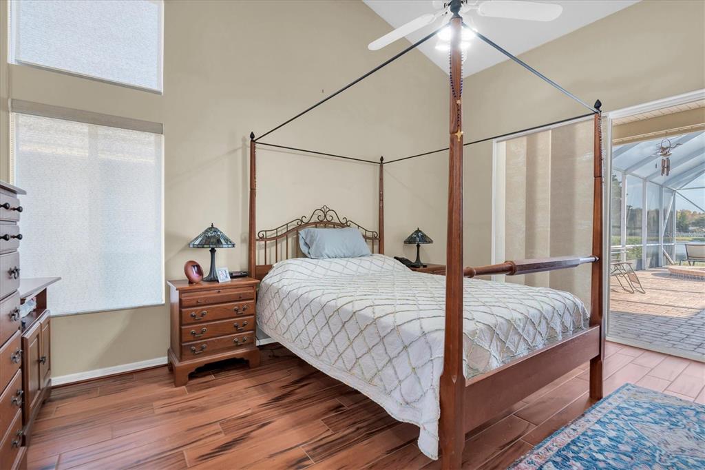 1226 Hoversham Drive New Port Richey, FL 34655 - Photo 24 of 41 a bedroom with a bed and wooden floor