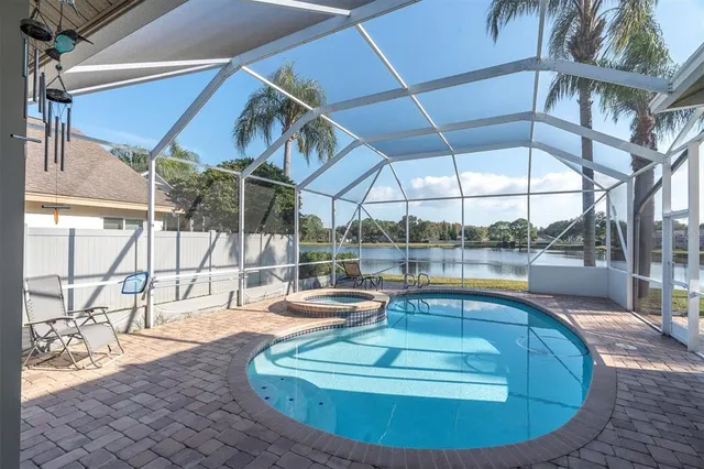 a view of a swimming pool with a patio