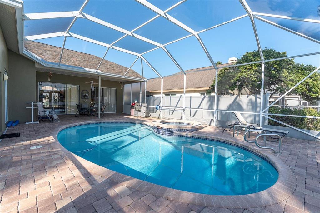 1226 Hoversham Drive New Port Richey, FL 34655 - Photo 38 of 41 a view of a swimming pool with a patio