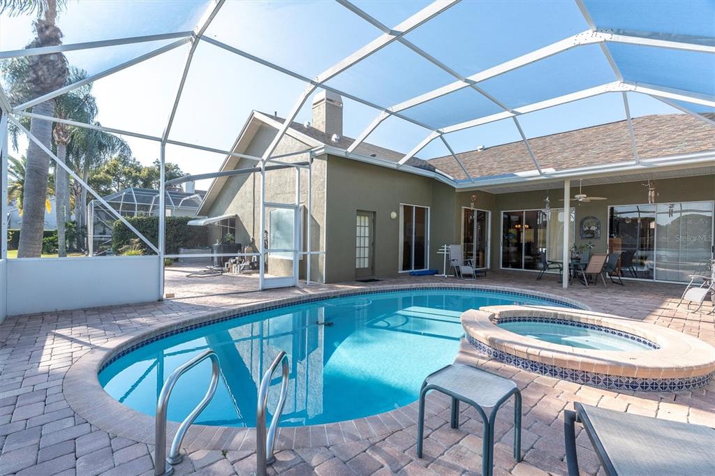 1226 Hoversham Drive New Port Richey, FL 34655 - Photo 39 of 41 a view of a patio with table and chairs