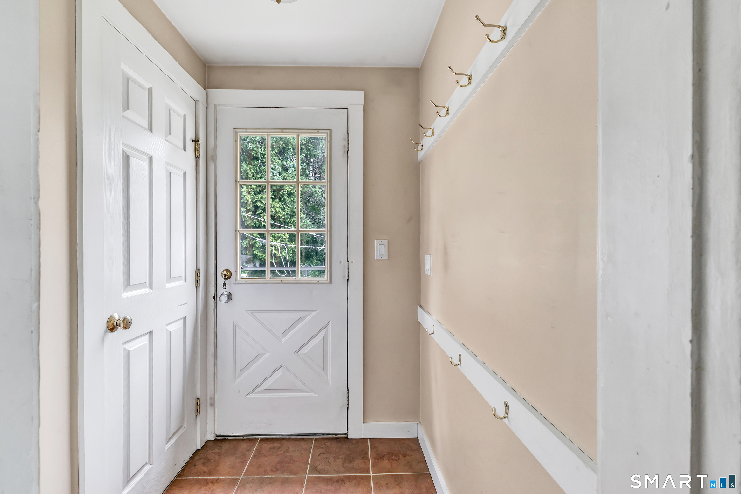 1326 Huntington Road Stratford, CT 06614 - Photo 19 of 37 Main Floor -Back Door - Leads into a rear private backyard .25 Acres built for Gardening and Entertaining.