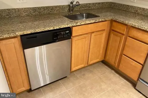 a view of a refrigerator in the kitchen