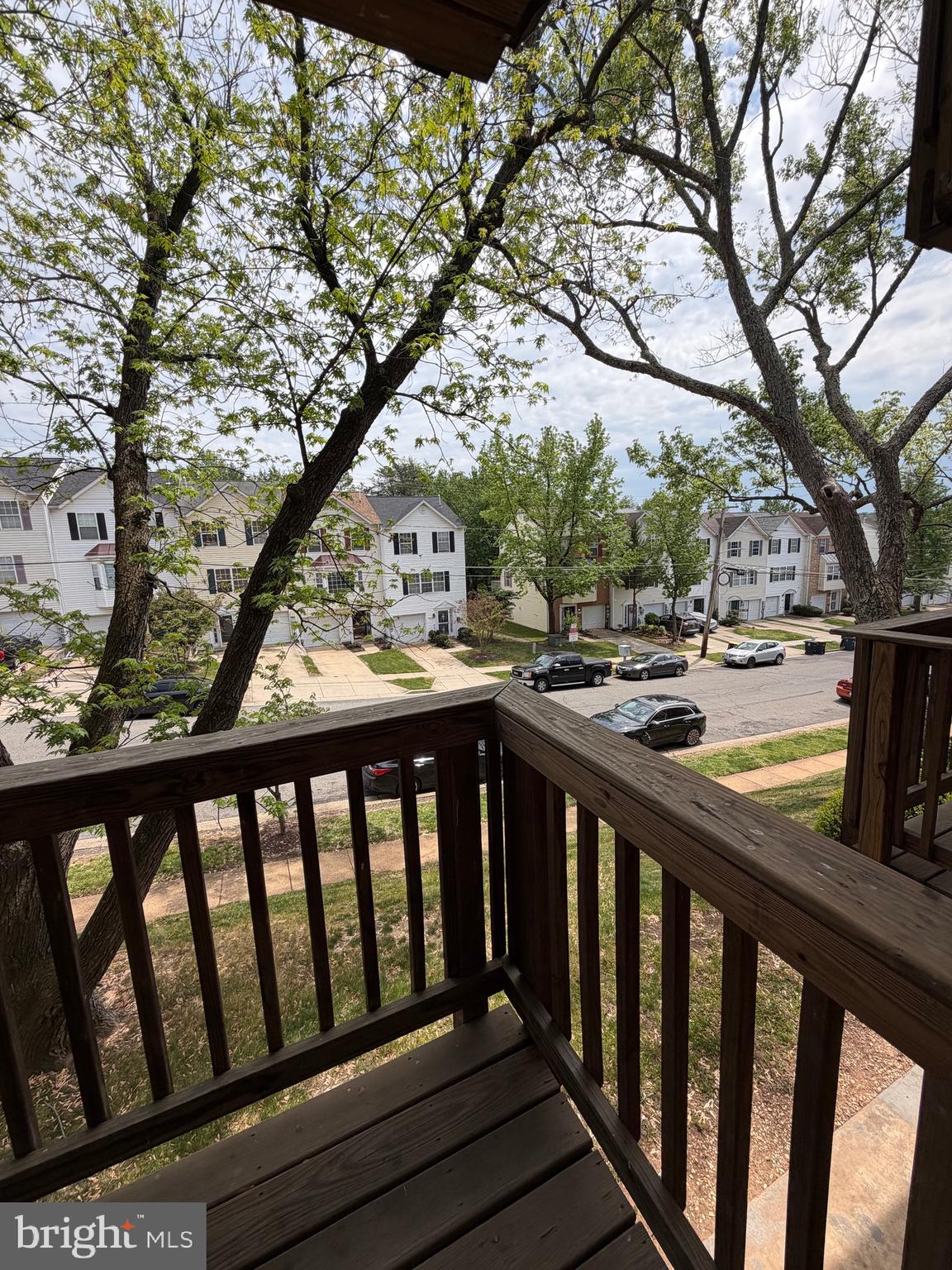 2514 Markham Lane, Unit 3 Landover, MD 20785 - Photo 2 of 13 a view of a balcony with wooden floor and fence