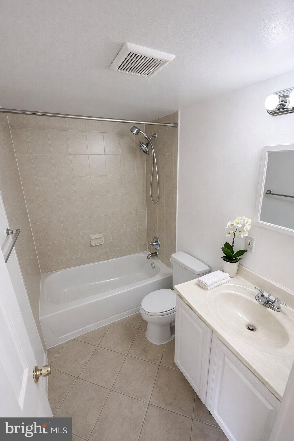 2514 Markham Lane, Unit 3 Landover, MD 20785 - Photo 8 of 13 a bathroom with a sink a toilet and a bathtub