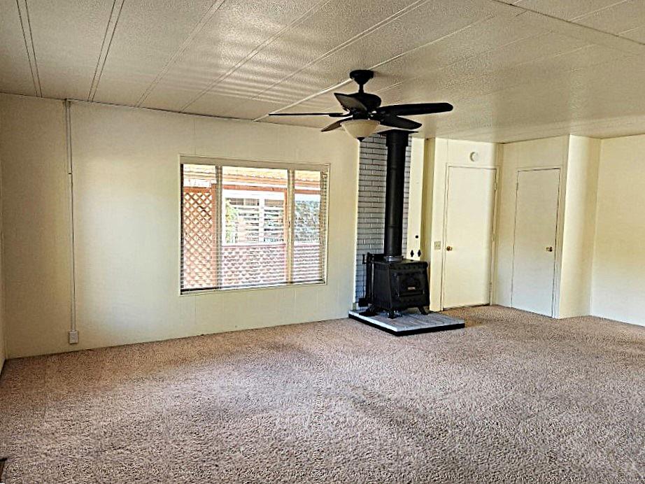 10113 Shamrock Lode Grass Valley, CA 95949 - Photo 11 of 34 a view of an empty room with a window
