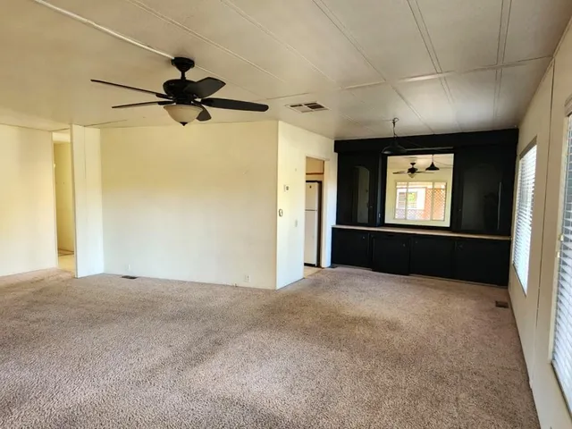 a large kitchen with a stove and a refrigerator