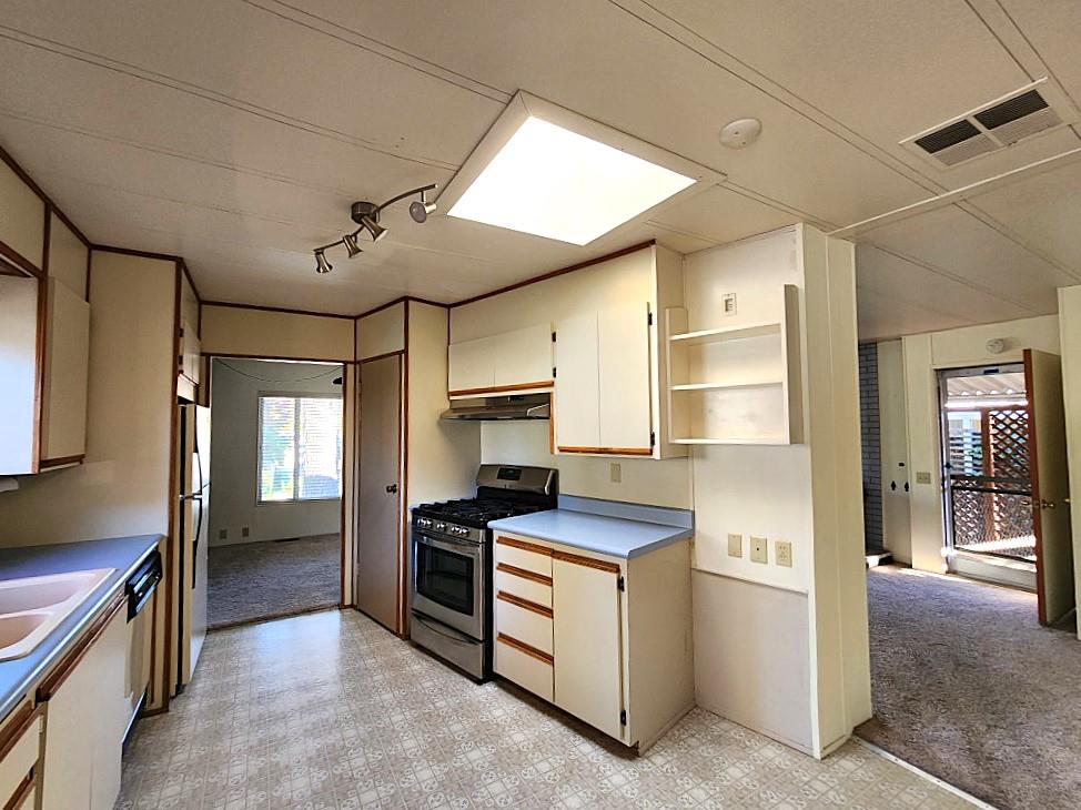 10113 Shamrock Lode Grass Valley, CA 95949 - Photo 18 of 34 a kitchen that has a sink and stainless steel appliances