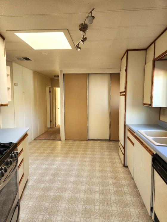10113 Shamrock Lode Grass Valley, CA 95949 - Photo 19 of 34 a view of a kitchen with stainless steel appliances granite countertop a stove and a refrigerator