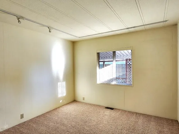 a white toilet sitting next to a shower