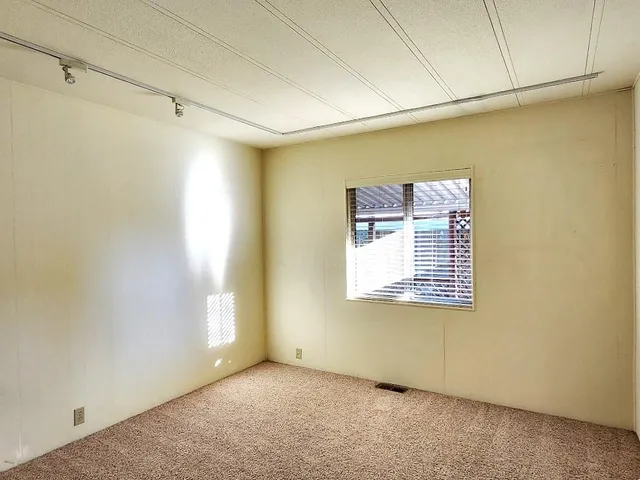 a white toilet sitting next to a shower
