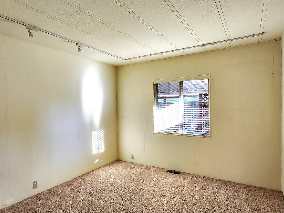 10113 Shamrock Lode Grass Valley, CA 95949 - Photo 21 of 34 a view of an empty room with a window