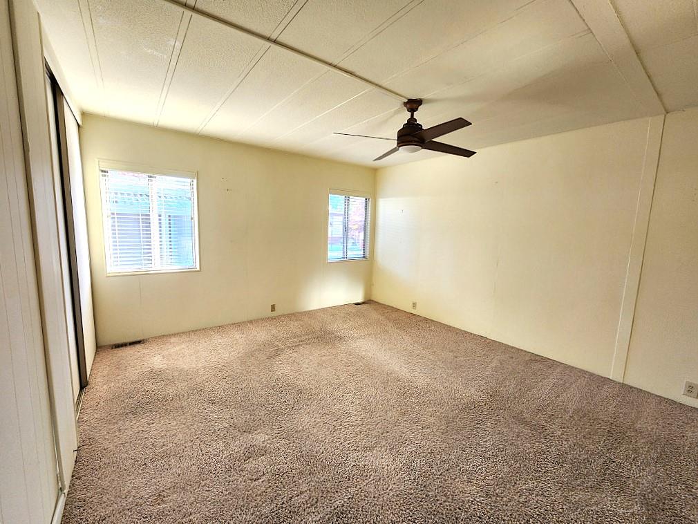 10113 Shamrock Lode Grass Valley, CA 95949 - Photo 25 of 34 an empty room with windows and fan
