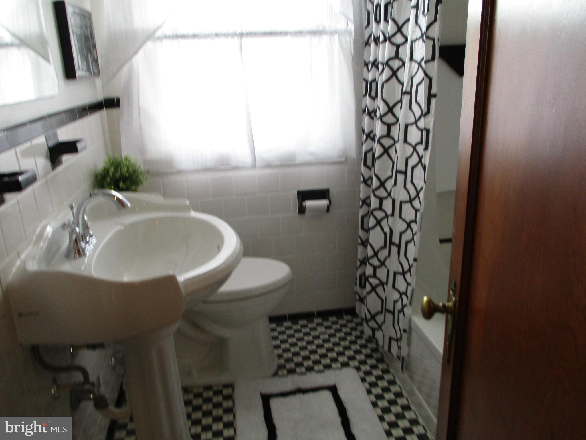2015 Crestview Road Baltimore, MD 21239 - Photo 12 of 21 a bathroom with a sink and a mirror