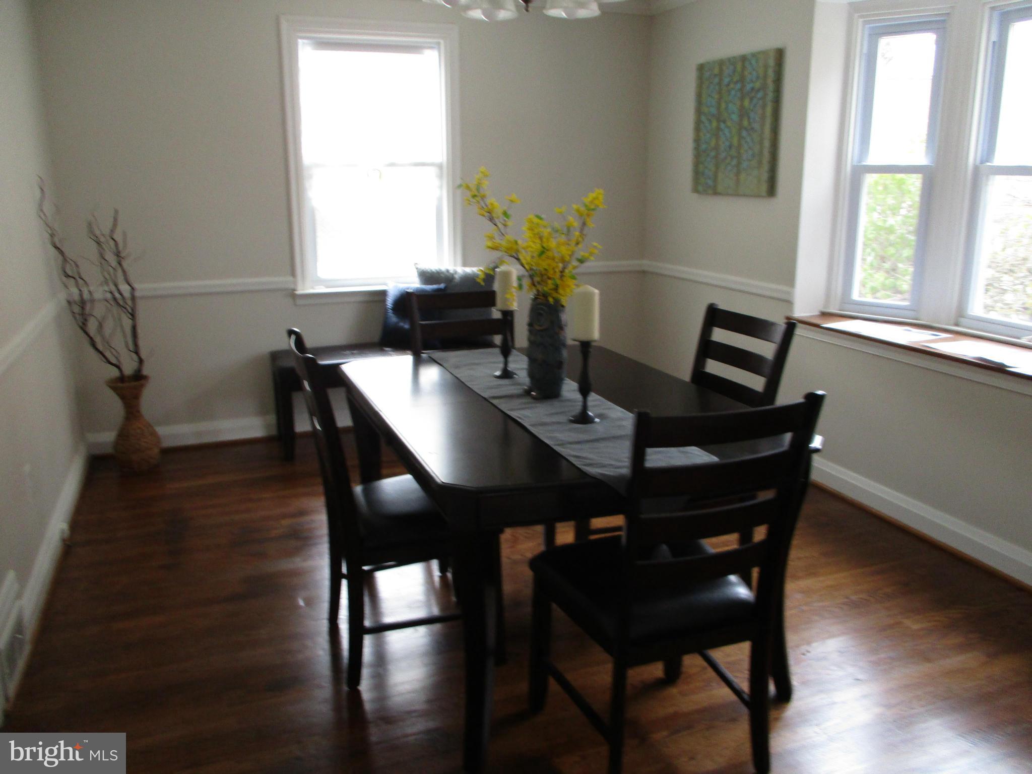 2015 Crestview Road Baltimore, MD 21239 - Photo 7 of 21 a view of a dining room with furniture and wooden floor