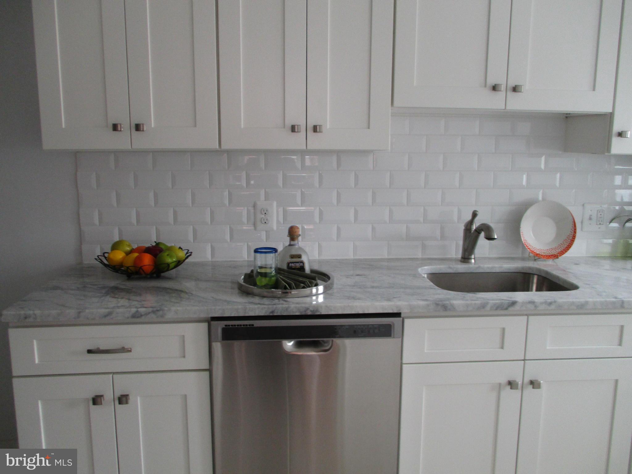 2015 Crestview Road Baltimore, MD 21239 - Photo 8 of 21 a kitchen with white cabinets and a sink
