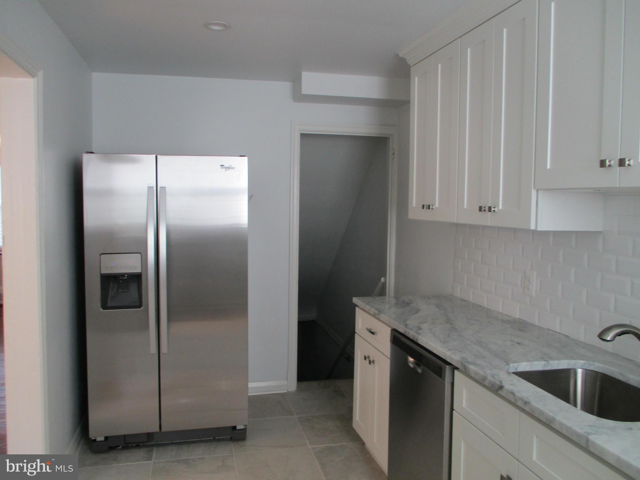 2015 Crestview Road Baltimore, MD 21239 - Photo 10 of 21 a kitchen with stainless steel appliances granite countertop a refrigerator and a sink