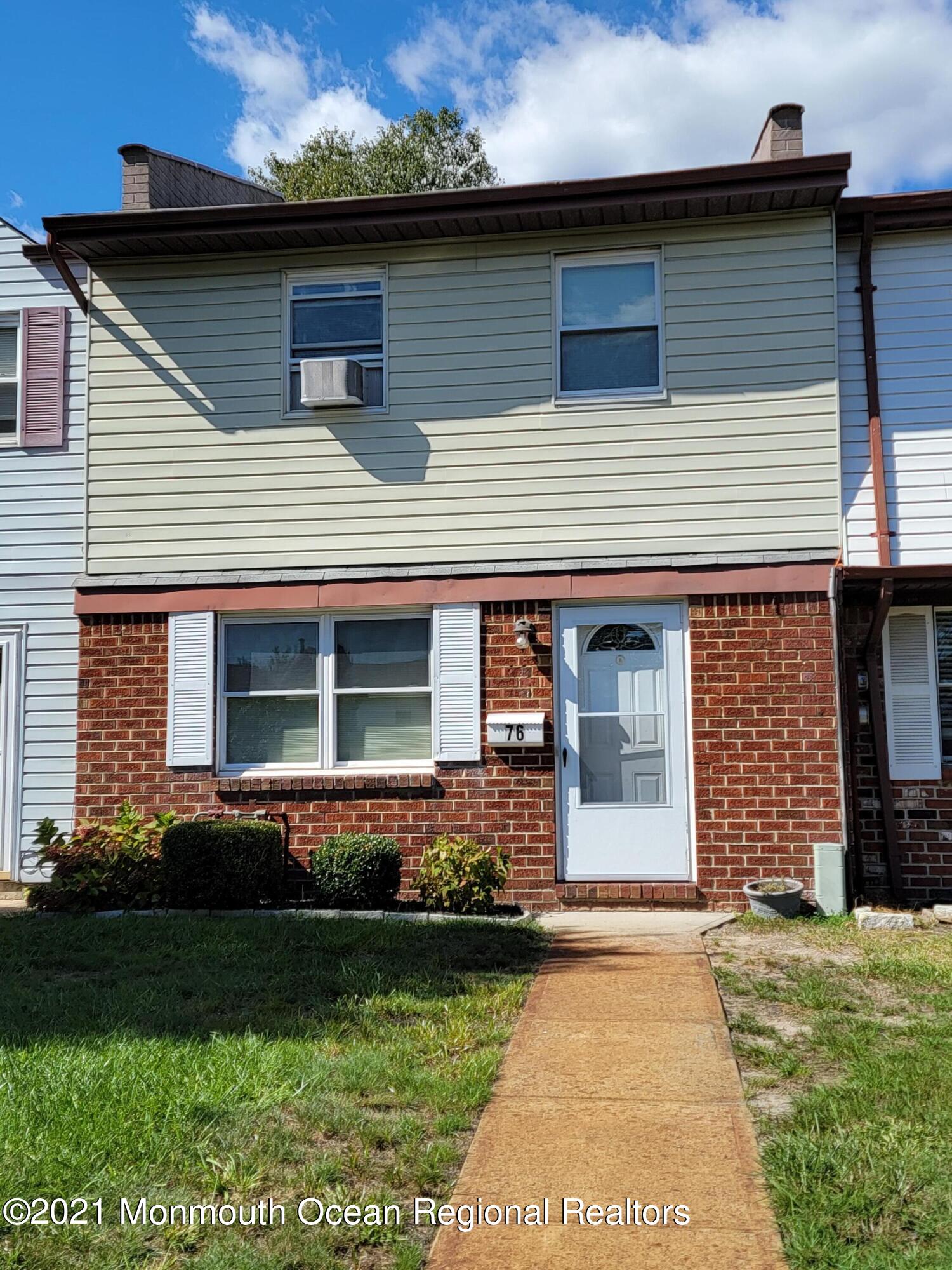 76 Greenwood Loop Road Brick, NJ 08724 - Photo 1 of 24 a front view of a house with garden