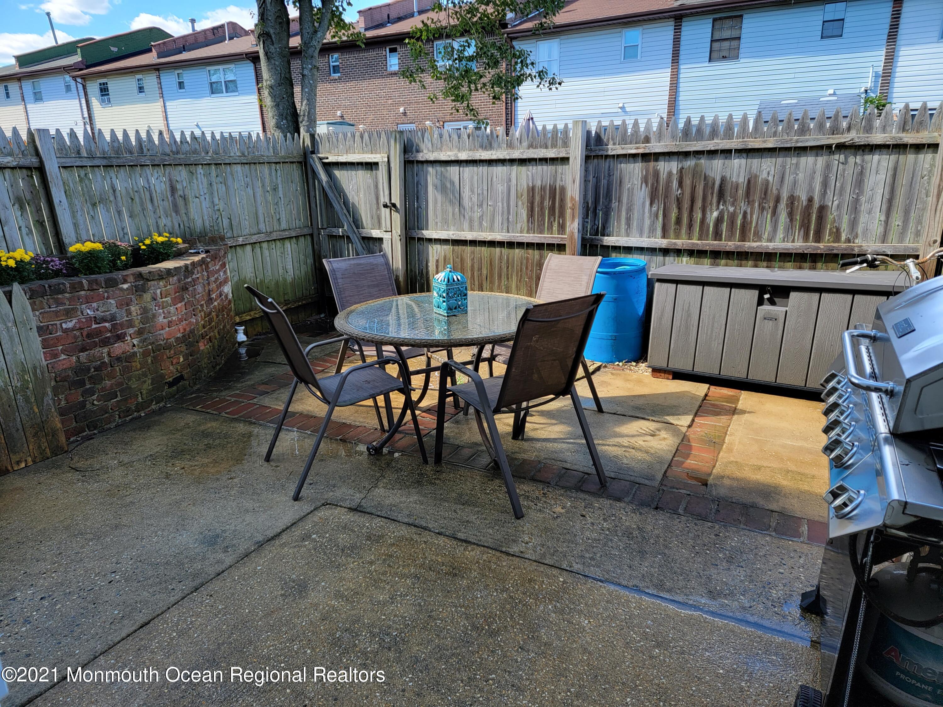 76 Greenwood Loop Road Brick, NJ 08724 - Photo 23 of 24 a view of a chairs and table in the patio