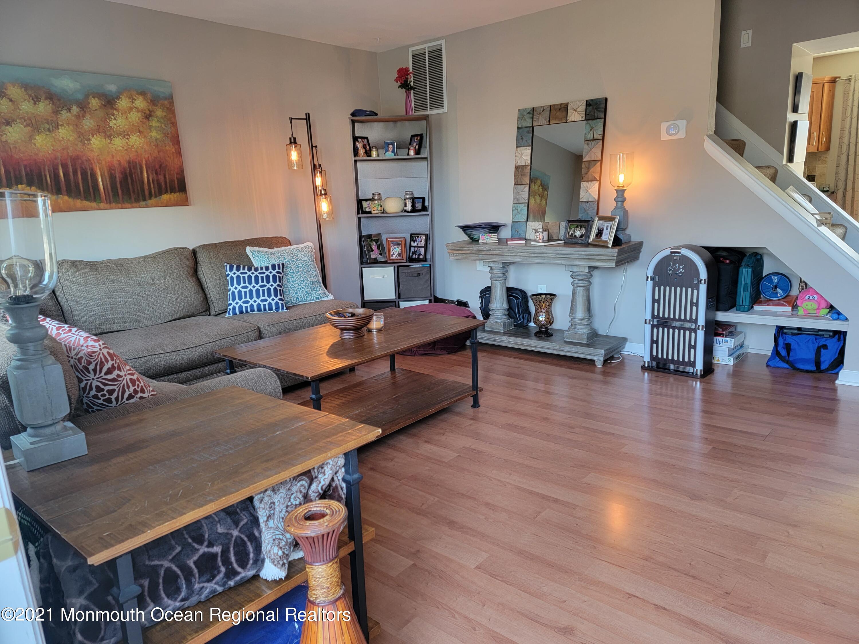 76 Greenwood Loop Road Brick, NJ 08724 - Photo 3 of 24 a living room with furniture and wooden floor