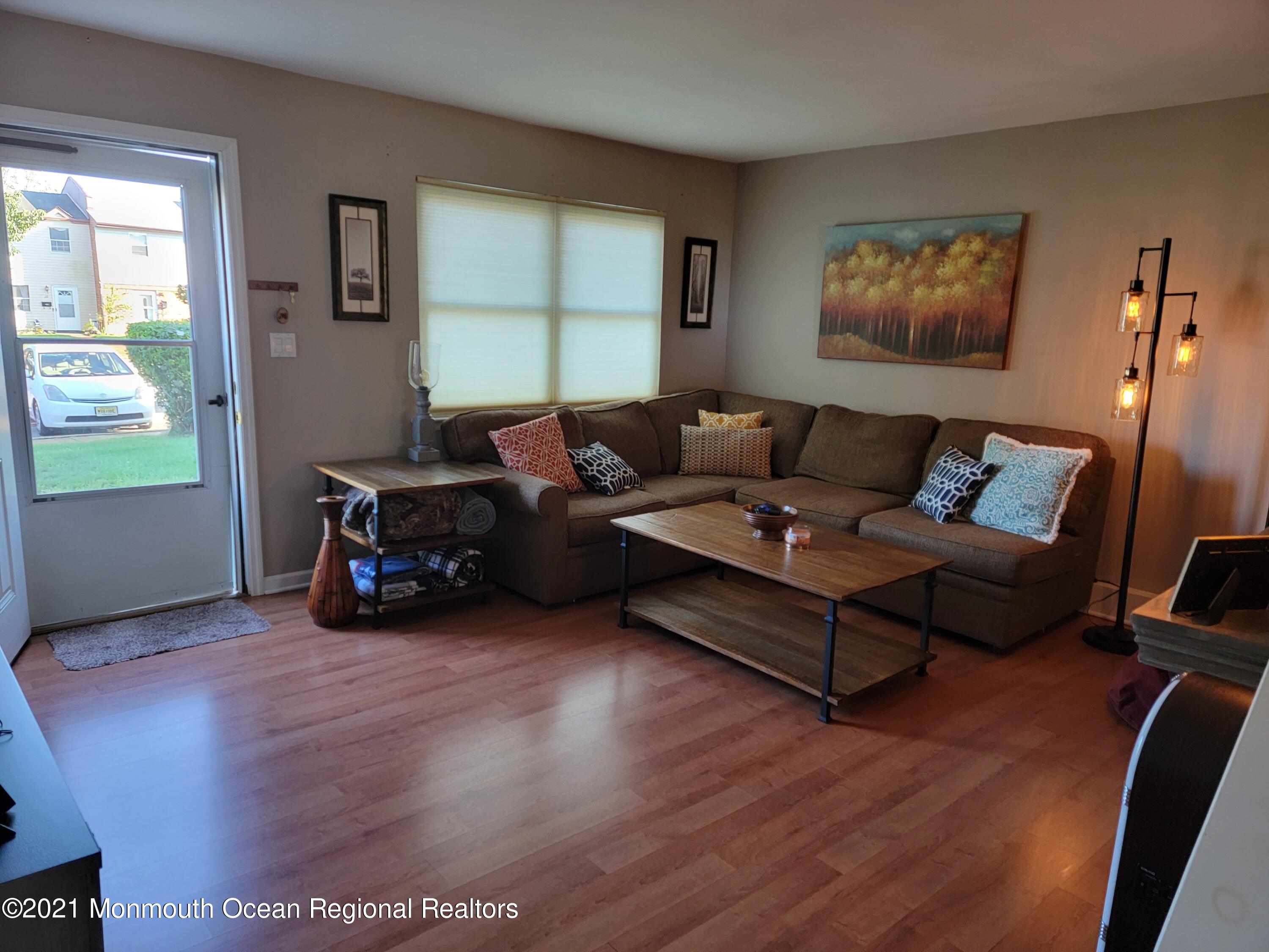 76 Greenwood Loop Road Brick, NJ 08724 - Photo 4 of 24 a living room with furniture and a window