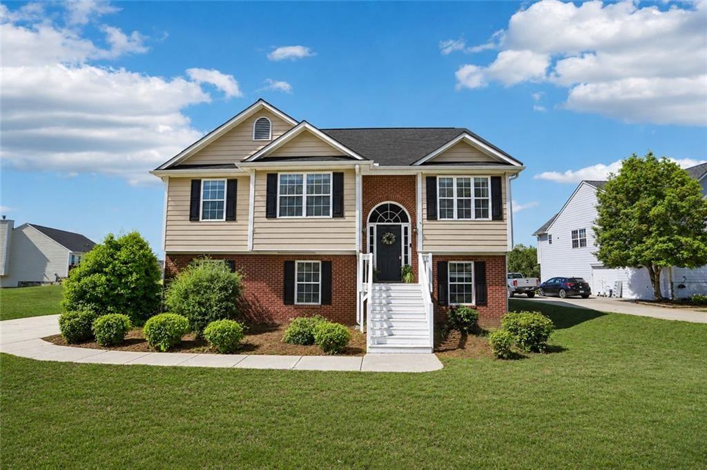9720 Poole Road Villa Rica, GA 30180 - Photo 1 of 40 a front view of a house with a yard