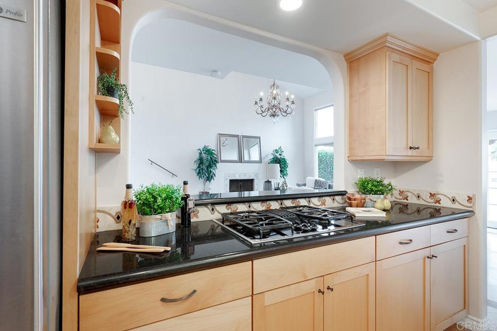 6 Admiralty Cross Coronado, CA 92118 - Photo 13 of 35 a kitchen with white cabinets and a stove