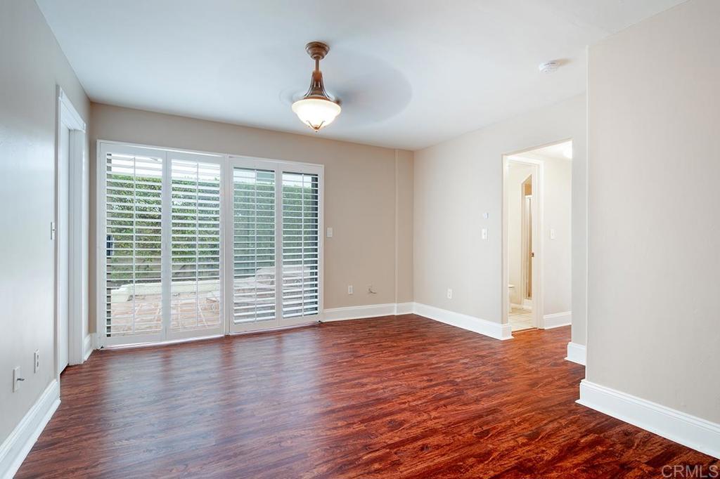 6 Admiralty Cross Coronado, CA 92118 - Photo 14 of 35 an empty room with wooden floor and windows