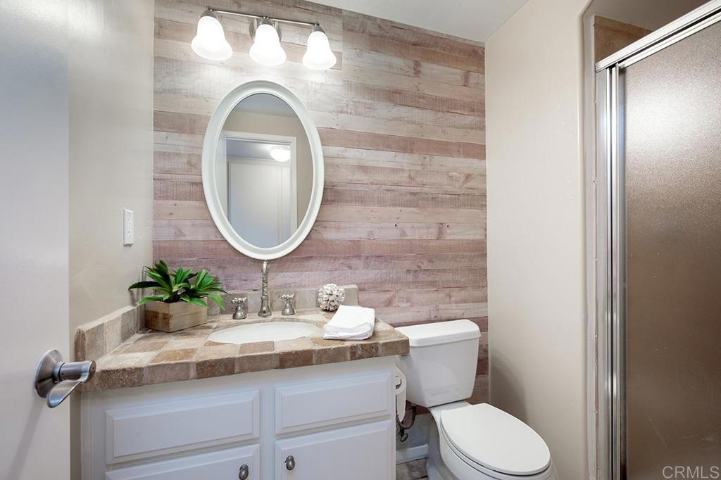 6 Admiralty Cross Coronado, CA 92118 - Photo 15 of 35 a bathroom with a sink mirror and toilet