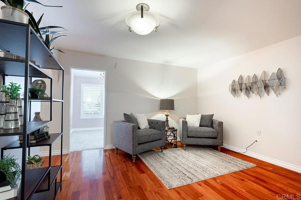 6 Admiralty Cross Coronado, CA 92118 - Photo 22 of 35 a living room with furniture and a wooden floor