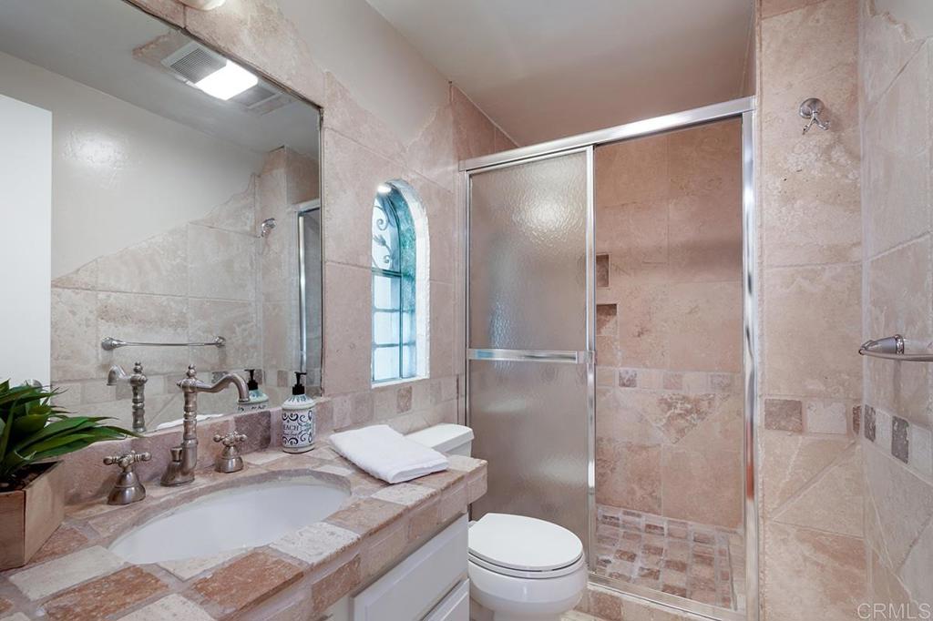 6 Admiralty Cross Coronado, CA 92118 - Photo 23 of 35 a bathroom with a sink a toilet and shower