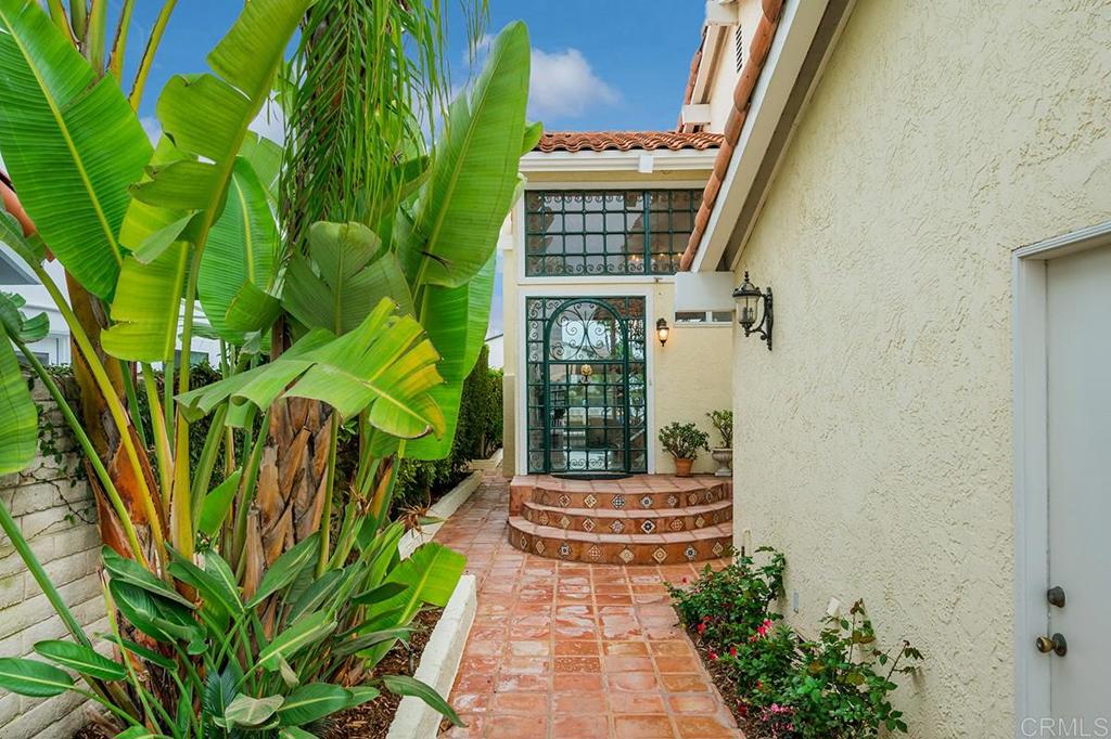 6 Admiralty Cross Coronado, CA 92118 - Photo 3 of 35 a front view of a house with a yard