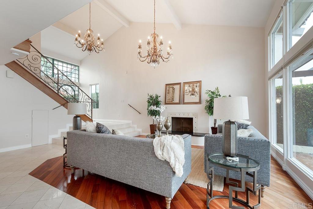 6 Admiralty Cross Coronado, CA 92118 - Photo 6 of 35 a living room with fireplace furniture and a chandelier