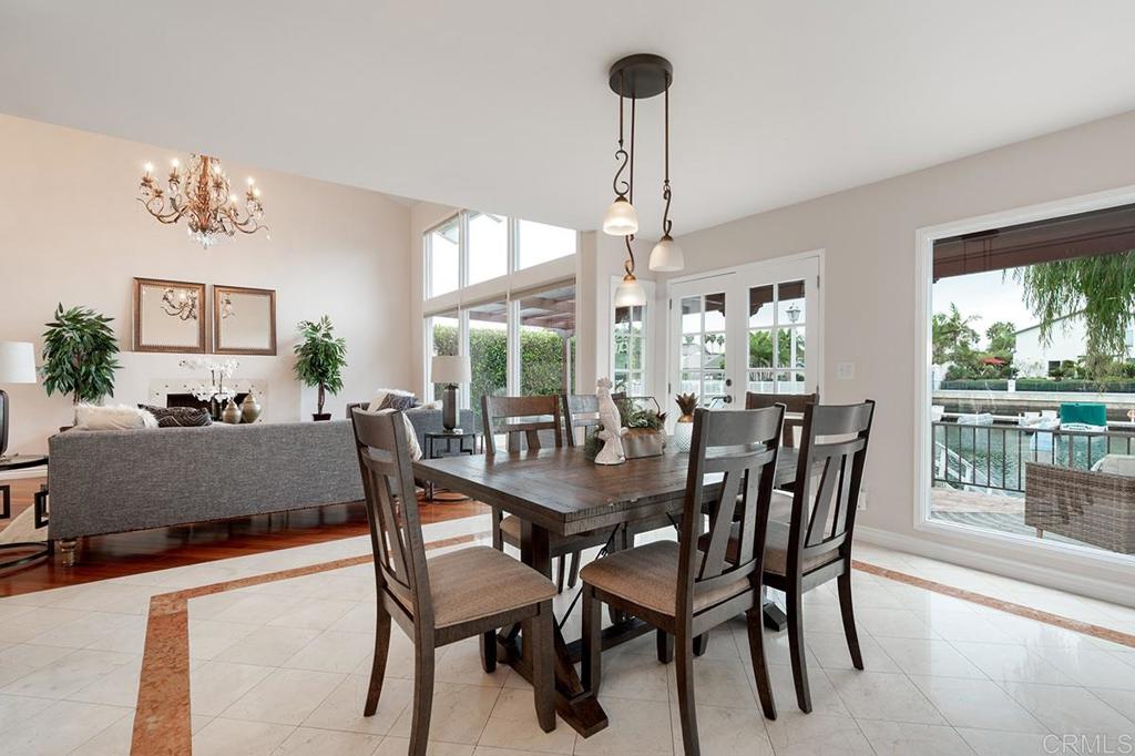 6 Admiralty Cross Coronado, CA 92118 - Photo 9 of 35 a view of a dining room and livingroom furniture wooden floor a chandelier